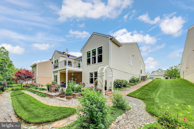 84 Battery Point Dr, Fredericksburg, VA 22406 - back of property with a balcony, a yard, a ceiling fan, a patio, and central AC