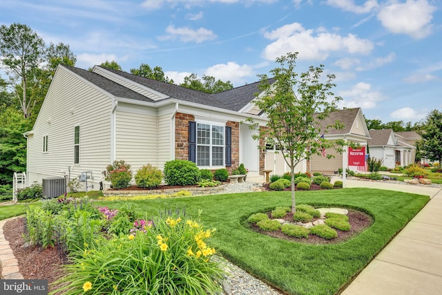 84 Battery Point Dr, Fredericksburg, VA 22406 - view of front facade featuring an attached garage, a front yard, concrete driveway, and central AC unit