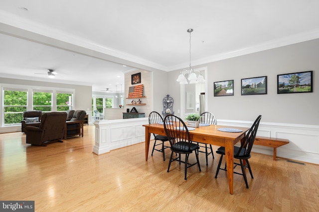 84 Battery Point Dr, Fredericksburg, VA 22406 - dining room featuring crown molding, a chandelier, light wood finished floors, ceiling fan, and wainscoting