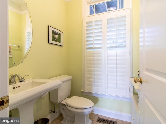 half bathroom with toilet and visible vents