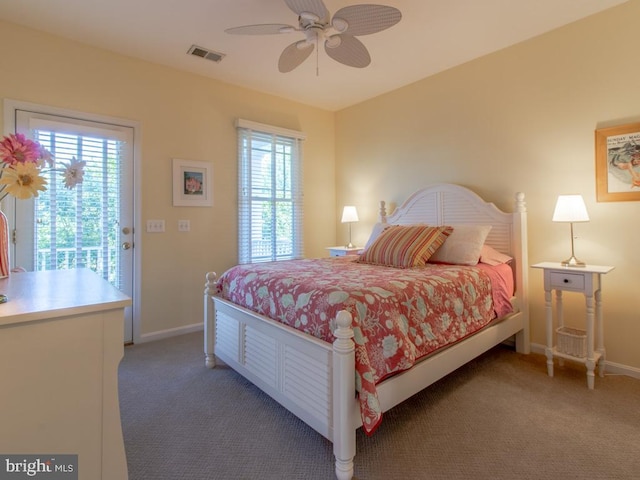 bedroom featuring visible vents, light carpet, baseboards, and multiple windows