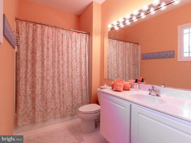 bathroom with vanity, toilet, and tile patterned flooring