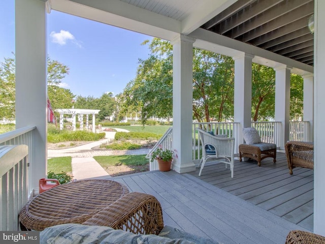 wooden terrace featuring covered porch