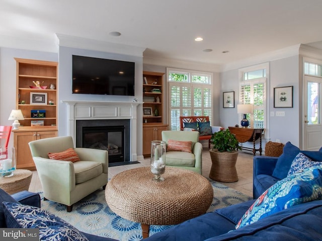 living area with a fireplace with flush hearth, recessed lighting, light tile patterned floors, crown molding, and built in shelves