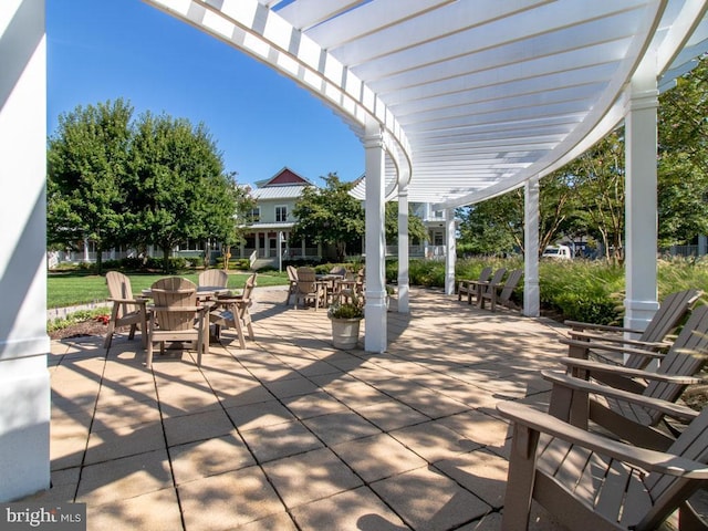 view of patio with a pergola and outdoor dining space