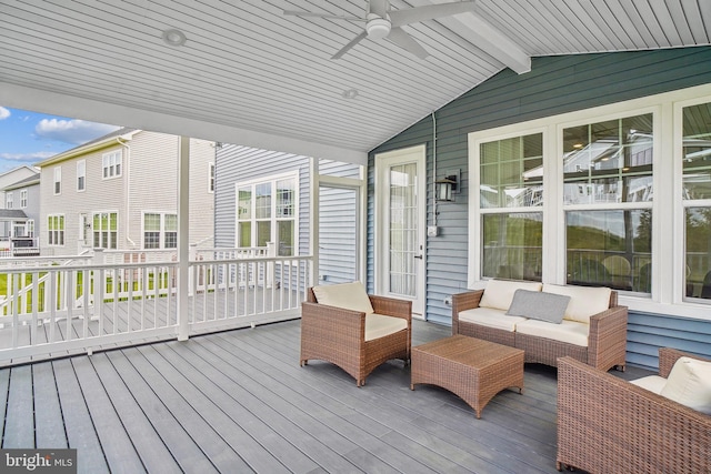wooden terrace featuring ceiling fan and an outdoor hangout area