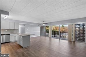 9201 New Hampshire Ave Unit 302, Silver Spring, MD 20903 - kitchen featuring dark wood-style floors, dishwasher, a ceiling fan, open floor plan, and white cabinetry