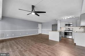 9201 New Hampshire Ave Unit 302, Silver Spring, MD 20903 - kitchen featuring a center island, a ceiling fan, stainless steel range with electric stovetop, light countertops, and dark wood-type flooring