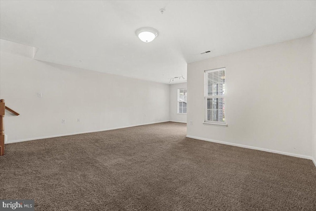 unfurnished living room featuring carpet flooring, baseboards, and visible vents