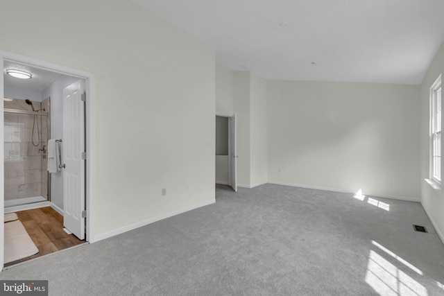 interior space with carpet flooring, baseboards, and visible vents