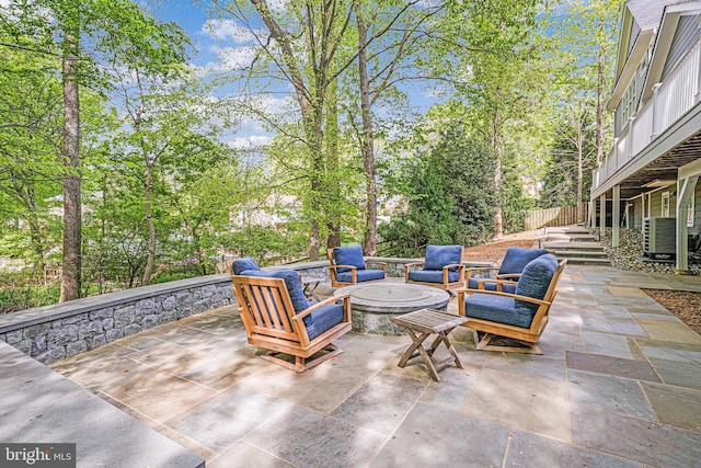 6020 Copely Ln, Mclean, VA 22101 - view of patio / terrace featuring central AC unit and an outdoor living space with a fire pit