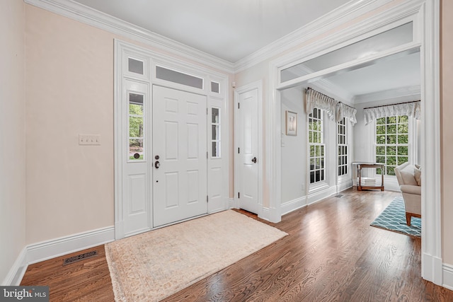 6020 Copely Ln, Mclean, VA 22101 - foyer entrance featuring baseboards, ornamental molding, wood finished floors, and visible vents