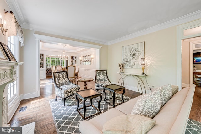 6020 Copely Ln, Mclean, VA 22101 - living room featuring crown molding, visible vents, wood finished floors, and a chandelier