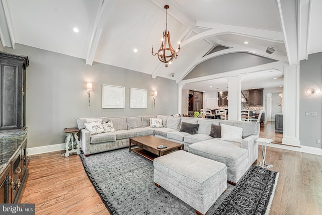 6020 Copely Ln, Mclean, VA 22101 - living room featuring vaulted ceiling with beams, light wood-style flooring, decorative columns, and recessed lighting