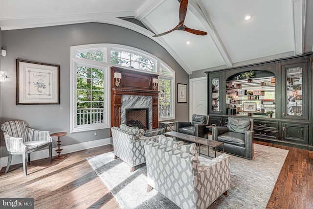 6020 Copely Ln, Mclean, VA 22101 - living area featuring wood finished floors, vaulted ceiling with beams, recessed lighting, a ceiling fan, and a premium fireplace