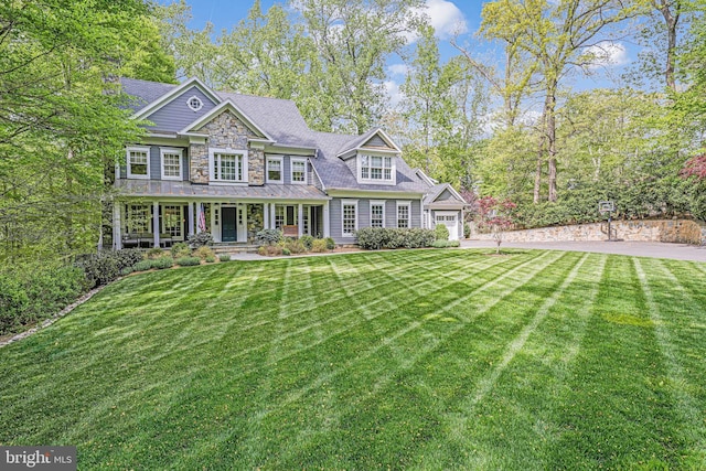 6020 Copely Ln, Mclean, VA 22101 - view of front of home featuring a porch, stone siding, driveway, and a front yard