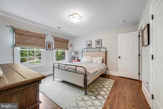 6020 Copely Ln, Mclean, VA 22101 - bedroom with baseboards, wood finished floors, and visible vents