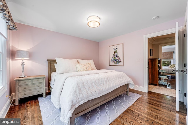 6020 Copely Ln, Mclean, VA 22101 - bedroom with baseboards and dark wood-style flooring