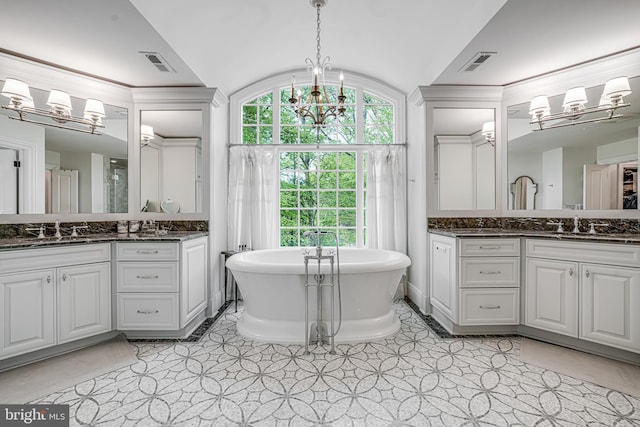 6020 Copely Ln, Mclean, VA 22101 - bathroom with an inviting chandelier, a sink, lofted ceiling, and visible vents