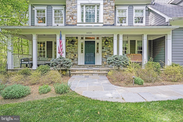 6020 Copely Ln, Mclean, VA 22101 - view of front facade featuring covered porch and stone siding