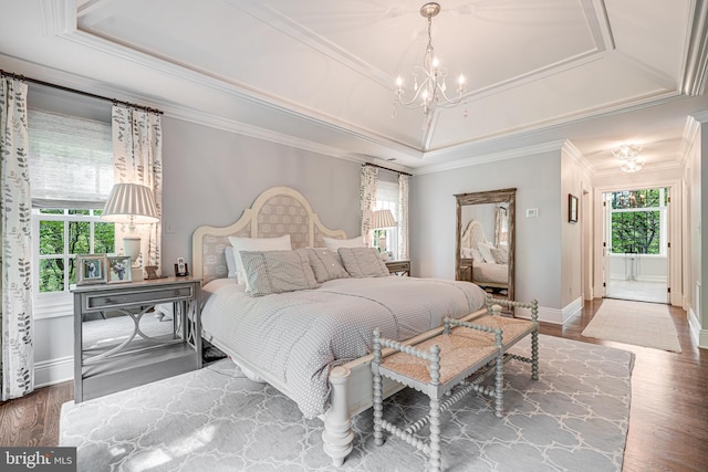 6020 Copely Ln, Mclean, VA 22101 - bedroom with wood finished floors, baseboards, a notable chandelier, ornamental molding, and a tray ceiling