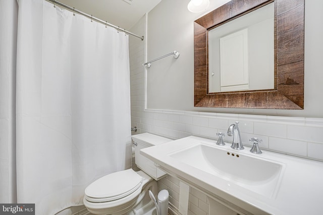 6020 Copely Ln, Mclean, VA 22101 - bathroom featuring backsplash, tile walls, curtained shower, a sink, and toilet
