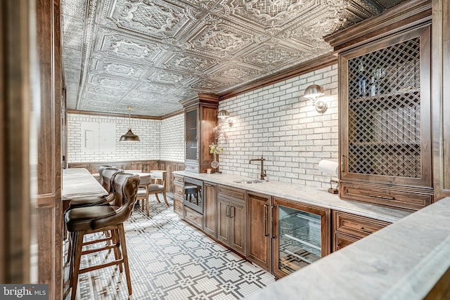 6020 Copely Ln, Mclean, VA 22101 - bar with a sink, an ornate ceiling, brick wall, wet bar, and light floors