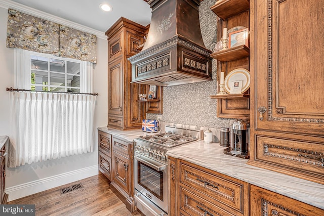 6020 Copely Ln, Mclean, VA 22101 - kitchen with visible vents, decorative backsplash, baseboards, light wood-style floors, and high end range