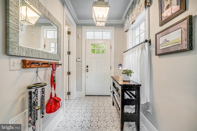 6020 Copely Ln, Mclean, VA 22101 - entryway with crown molding, baseboards, and a chandelier