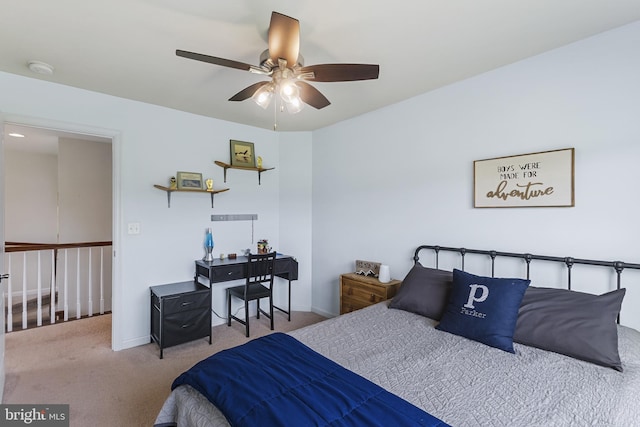 carpeted bedroom featuring a ceiling fan and baseboards