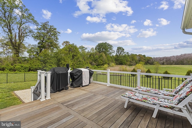 deck featuring a lawn, area for grilling, and fence