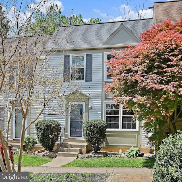 view of front of home featuring entry steps and roof with shingles