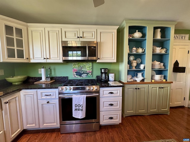 kitchen with dark wood-type flooring, appliances with stainless steel finishes, open shelves, and white cabinetry