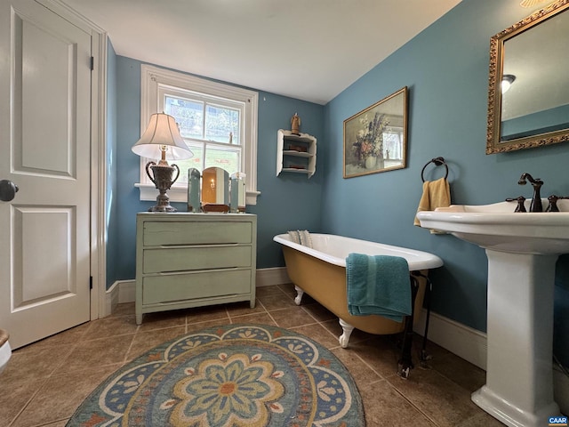 interior space featuring baseboards and tile patterned floors
