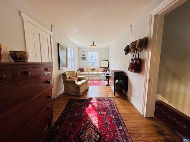 living room featuring baseboards and wood finished floors