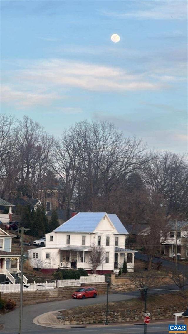 view of road with sidewalks and curbs
