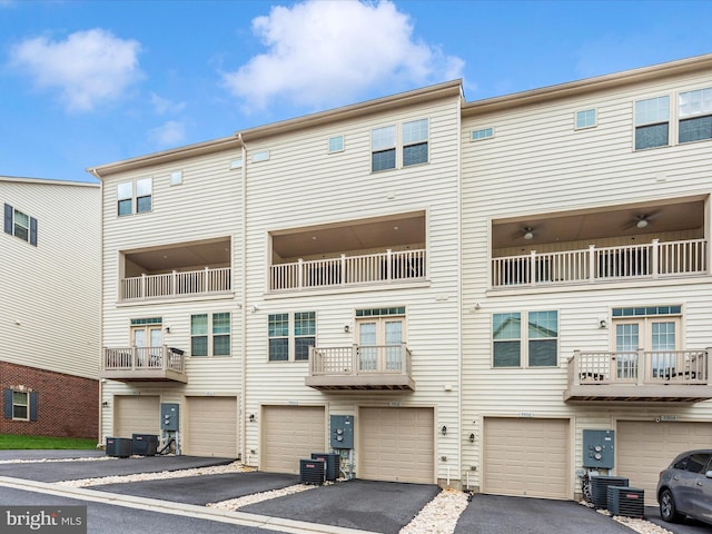 5910 Etterbeek St, Ijamsville, MD 21754 - view of building exterior with a garage, driveway, and central AC unit