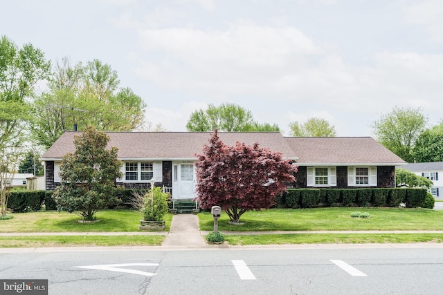 ranch-style home with a front yard