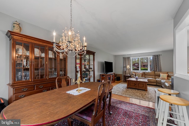 2411 Nickoles Dr, Sykesville, MD 21784 - dining room with wood finished floors and a notable chandelier
