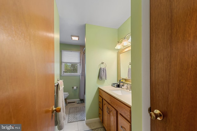 2411 Nickoles Dr, Sykesville, MD 21784 - bathroom featuring a shower with shower door, tile patterned floors, toilet, vanity, and baseboards