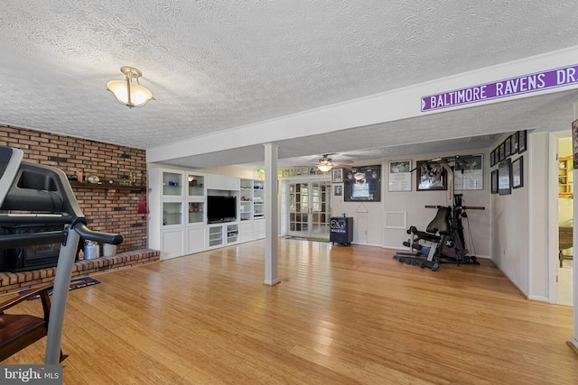2411 Nickoles Dr, Sykesville, MD 21784 - workout room featuring ceiling fan, wood finished floors, and a textured ceiling