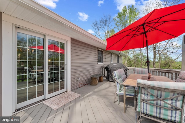 2411 Nickoles Dr, Sykesville, MD 21784 - wooden deck featuring area for grilling and outdoor dining space