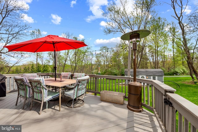 2411 Nickoles Dr, Sykesville, MD 21784 - deck featuring outdoor dining area, an outdoor structure, and a yard