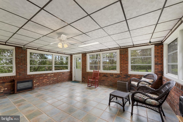 2411 Nickoles Dr, Sykesville, MD 21784 - sunroom / solarium featuring brick wall, tile patterned flooring, and a wealth of natural light