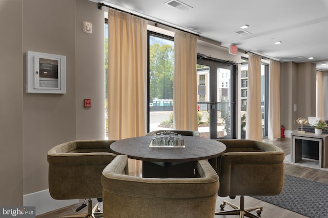 dining area featuring visible vents and wood finished floors