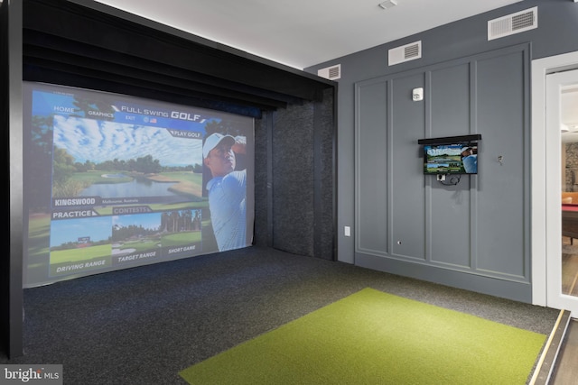recreation room with carpet floors, golf simulator, and visible vents