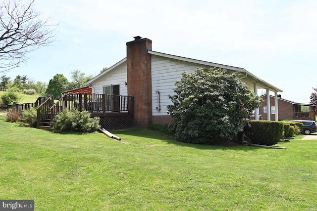 4092 Manchester St, Glen Rock, PA 17327 - view of home's exterior featuring a chimney, a deck, and a yard