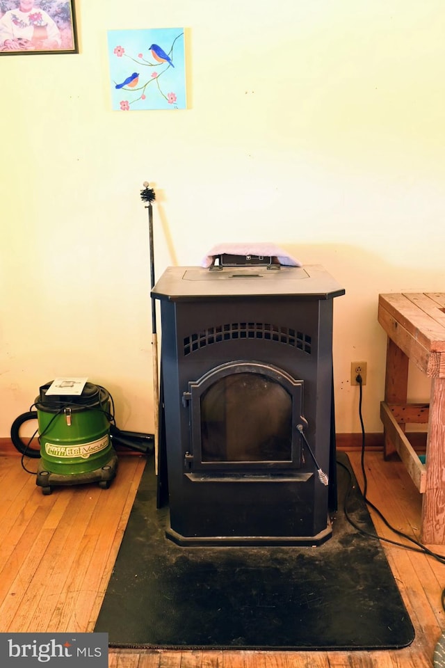 4092 Manchester St, Glen Rock, PA 17327 - detailed view of a wood stove, wood finished floors, and baseboards