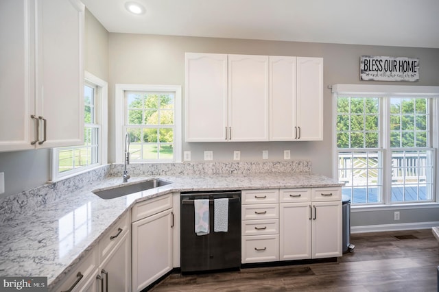 kitchen featuring dark wood-style floors, dishwasher, a sink, light stone countertops, and white cabinetry