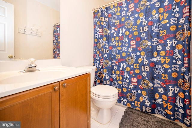 full bath with curtained shower, tile patterned flooring, vanity, and toilet